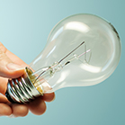 hand holding Incandescent Bulb